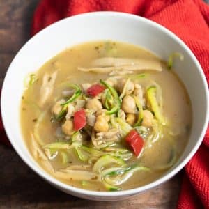 chickpea zucchini noodle soup in a white bowl