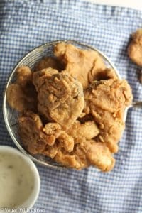 fried oyster mushrooms in a colander