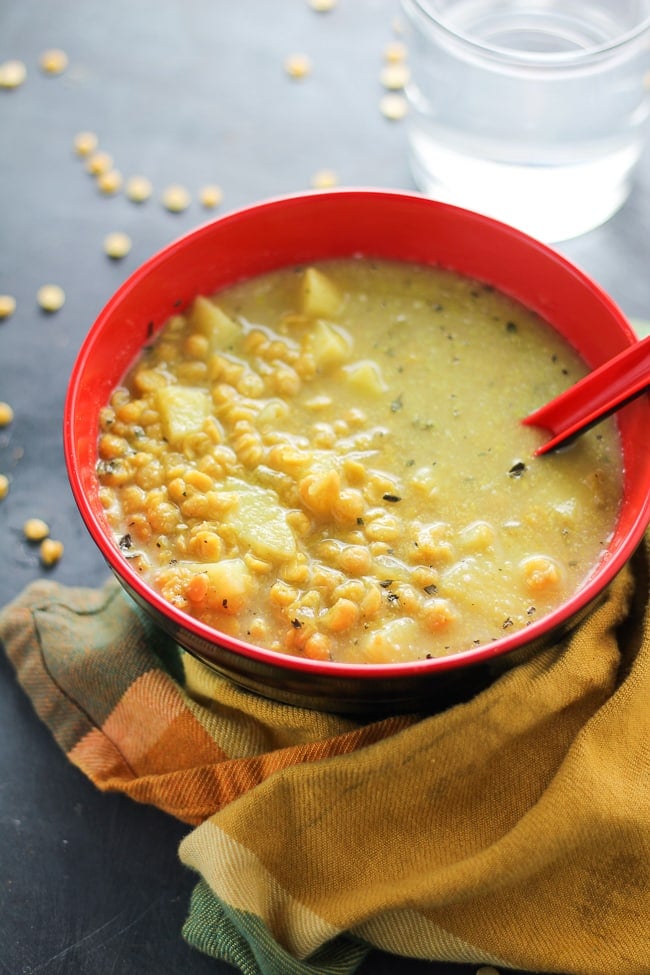 crock pot split pea soup in a red and black bowl