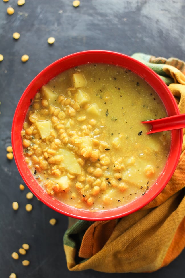 crock pot split pea soup in a red and black bowl