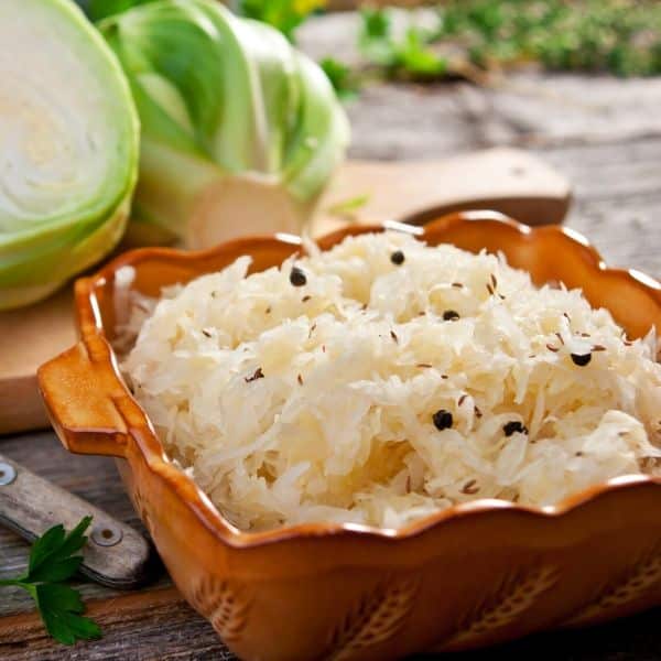 raw sauerkraut next to cabbage to emphasize digestion