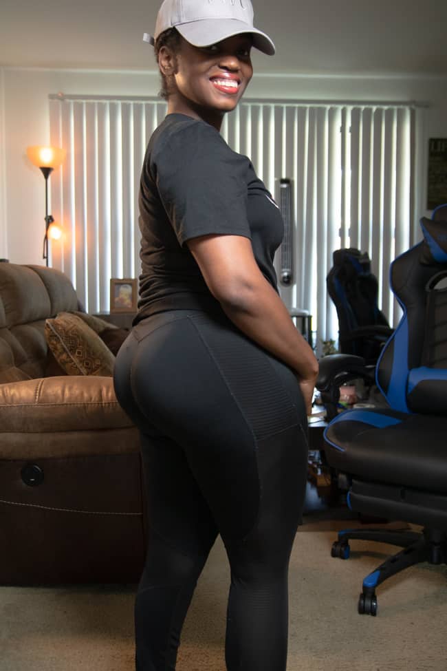 vegan with curves wearing a black workout outfit showing her curves