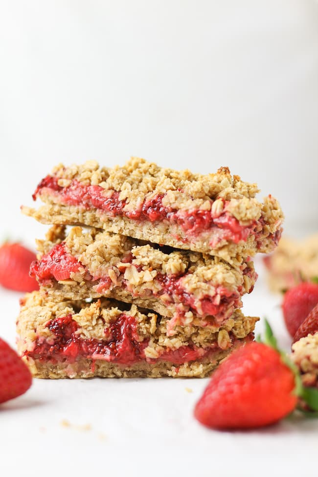 three strawberry oatmeal bars stacked on top of each other