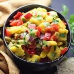 mango avocado salsa in a black bowl