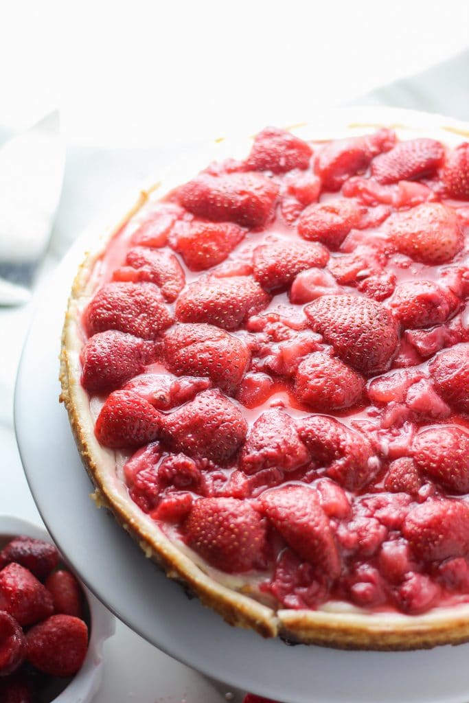 Unsliced strawberry vegan cheesecake