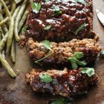 vegan meatloaf on a baking pan with green beans