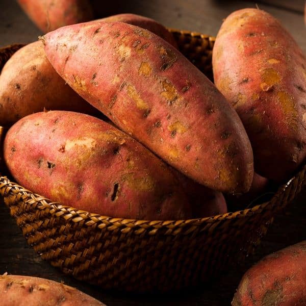 sweet potatoes in a basket to reference eating carbs