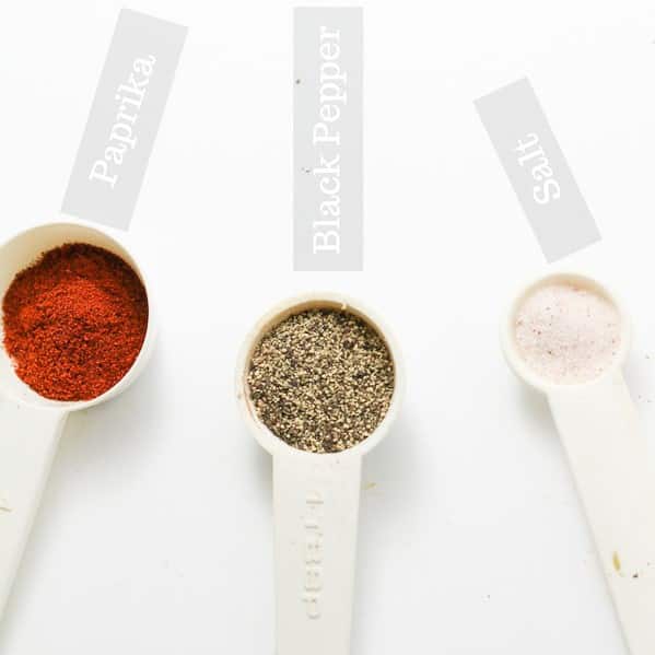 picture of paprika, black pepper, and salt in separate measuring teaspoons