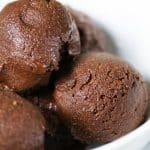 close up photo of chocolate ice cream in a white bowl