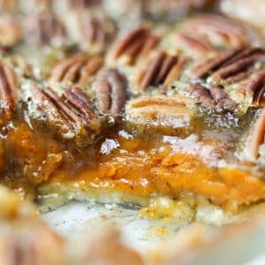 sweet potato pecan pie sliced through to show the both layers of the filling