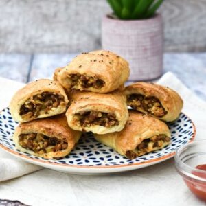lentil pastry rolls on a plate stacked on top of each other