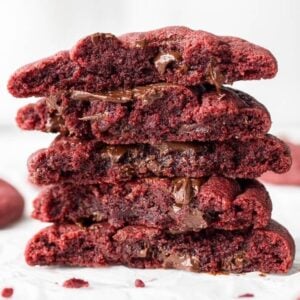 red velvet cookies cut in half stacked on top of each other