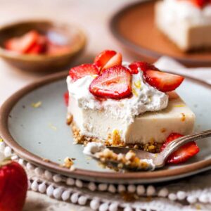 strawberry cheesecake bar on a white plate