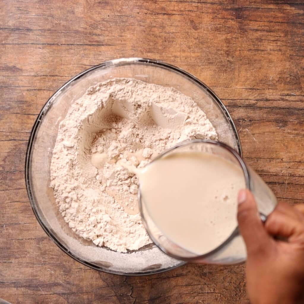 pouring milking in flour