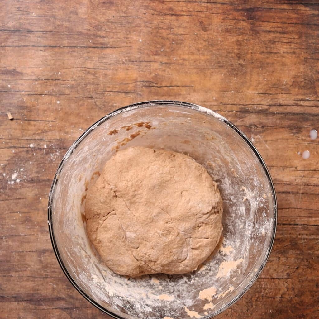 forming a dough ball in a bowl