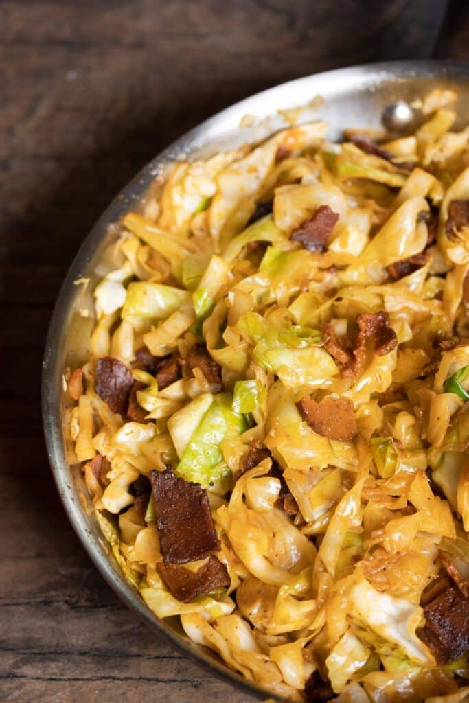 close up top angle of vegan fried cabbage in a skillet