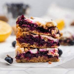 blueberry crumb bars stacked on top of each other