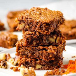 carrot cake bars stacked on top of each other