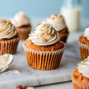 carrot cupcake with frosting on top