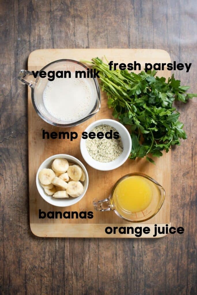 ingredients for parsley smoothie on cutting board
