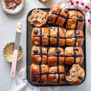 chocolate hot cross buns in a baking pan