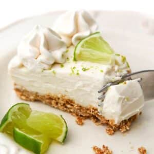 slice lime cheesecake on a plate with fork