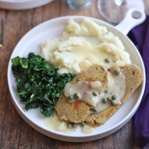vegan picatta with mashed potatoes and kale on a plate