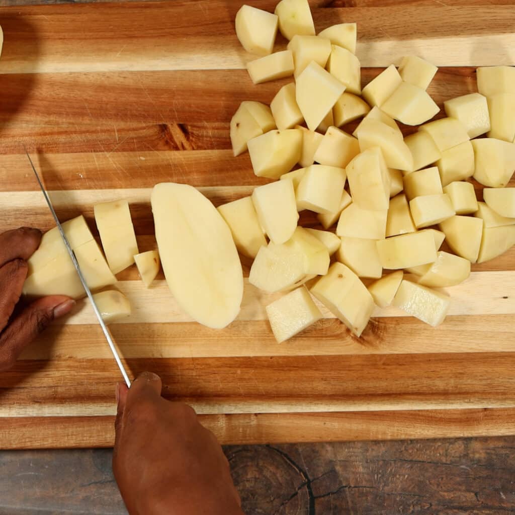 chopped potatoes on cutting board