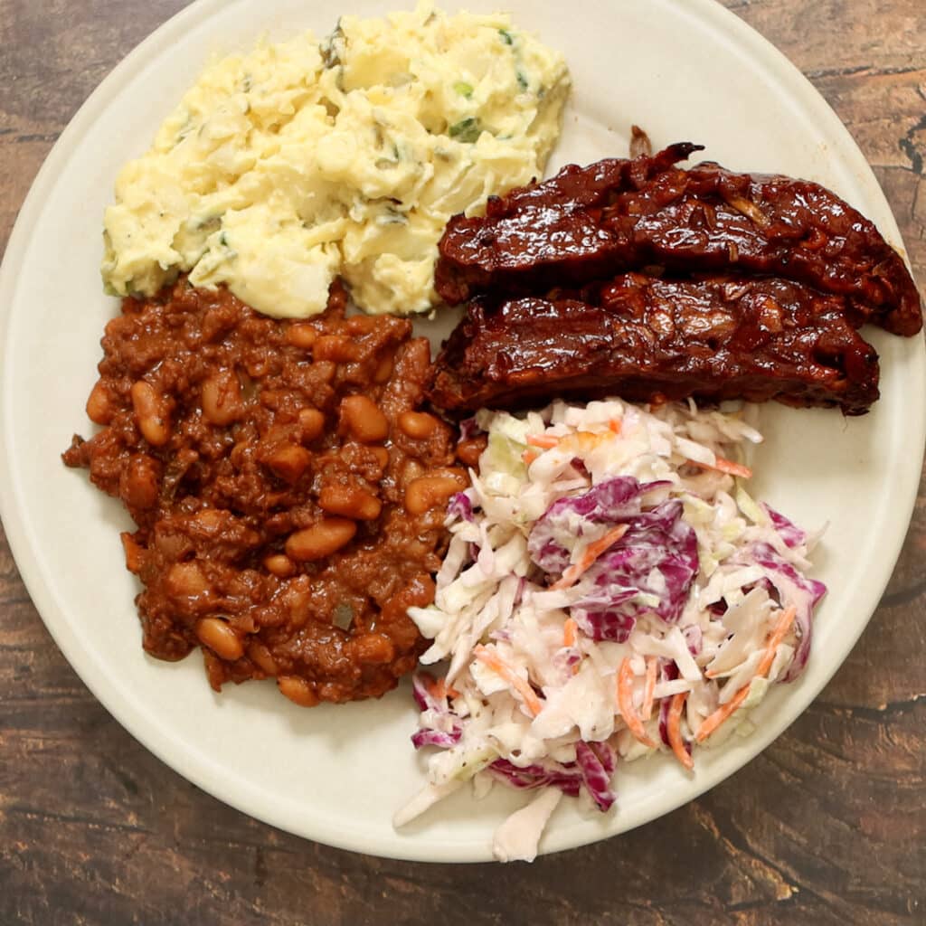 coleslaw on a plate with other vegan bbq recipes