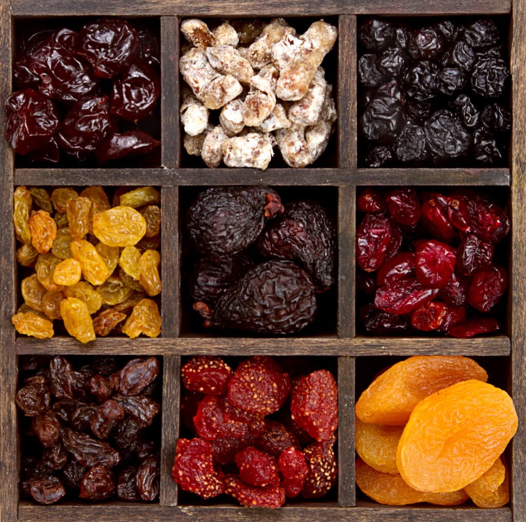 Assorted dried fruit arranged in a printers box