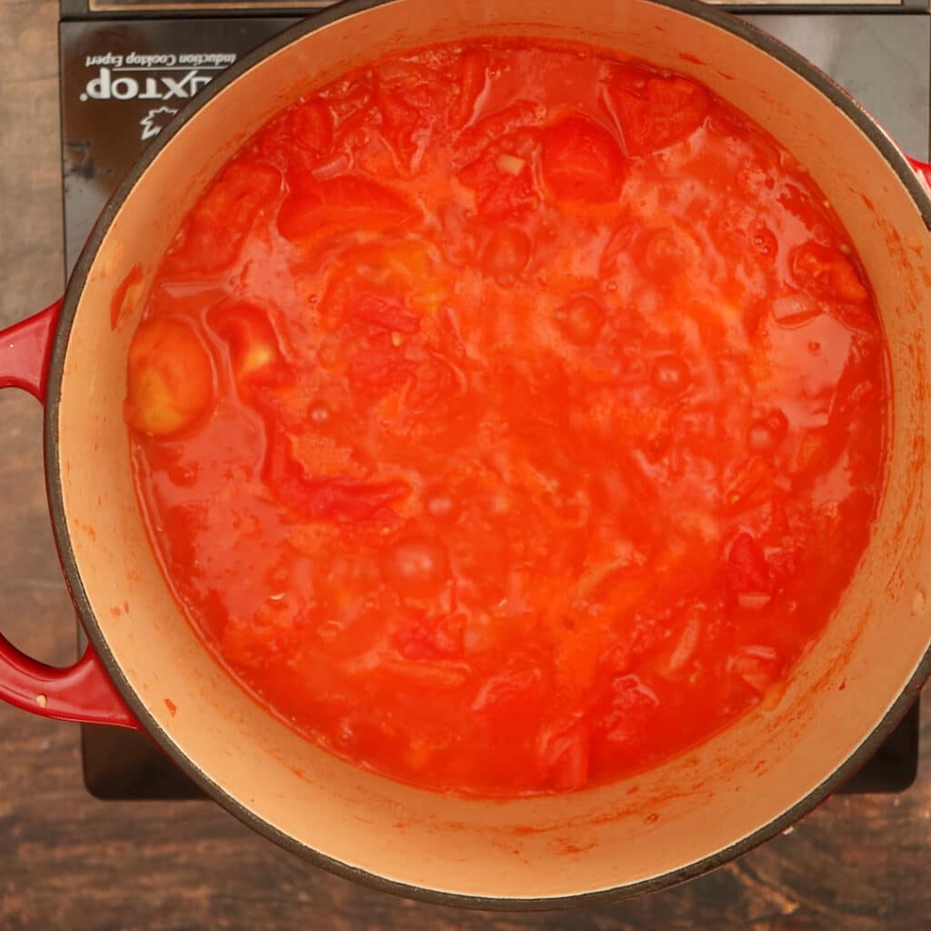 simmering tomatoes in a pot