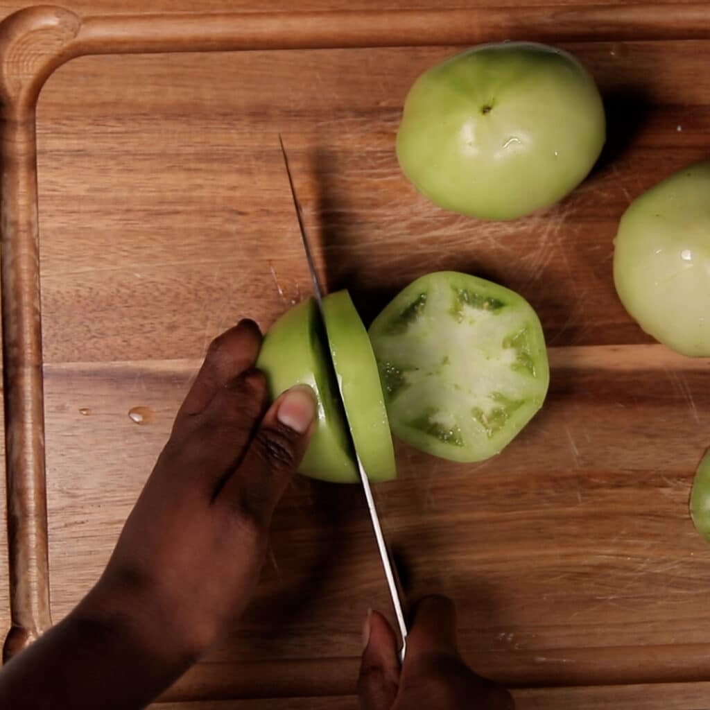green tomatoes being chopped