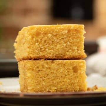 slice of cornbread stacked on top of a plate