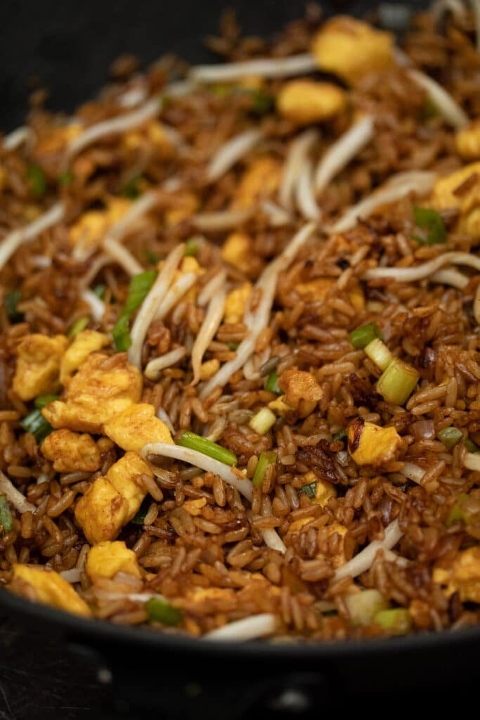 close up photo of fried rice in a wok