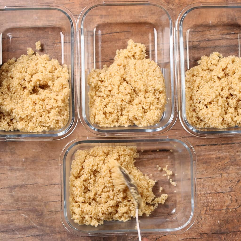quinoa being added to meal prep containers