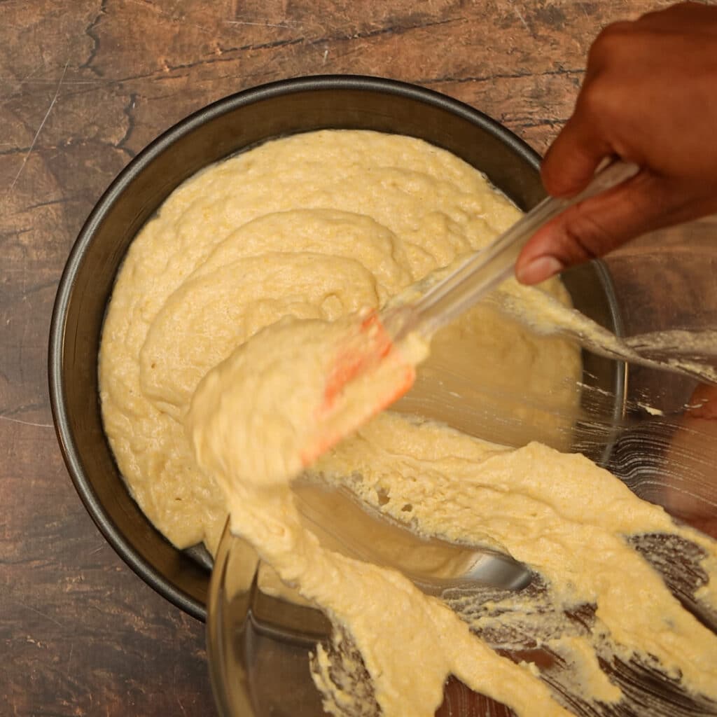 adding batter to baking pan