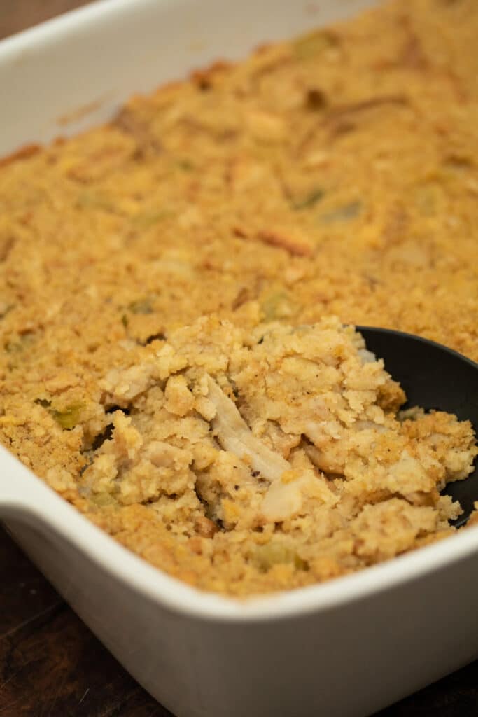 cornbread dressing in a white baking dish