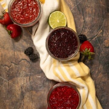 strawberry, blackberry, and raspberry chia jam in small mason jars