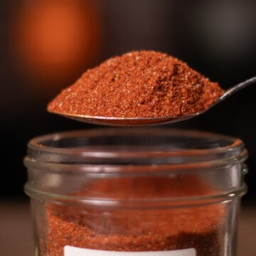 BBQ Spice Seasoning being scooped from mason jar on a spoon