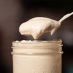 mayo on a spoon scooped from a mason jar