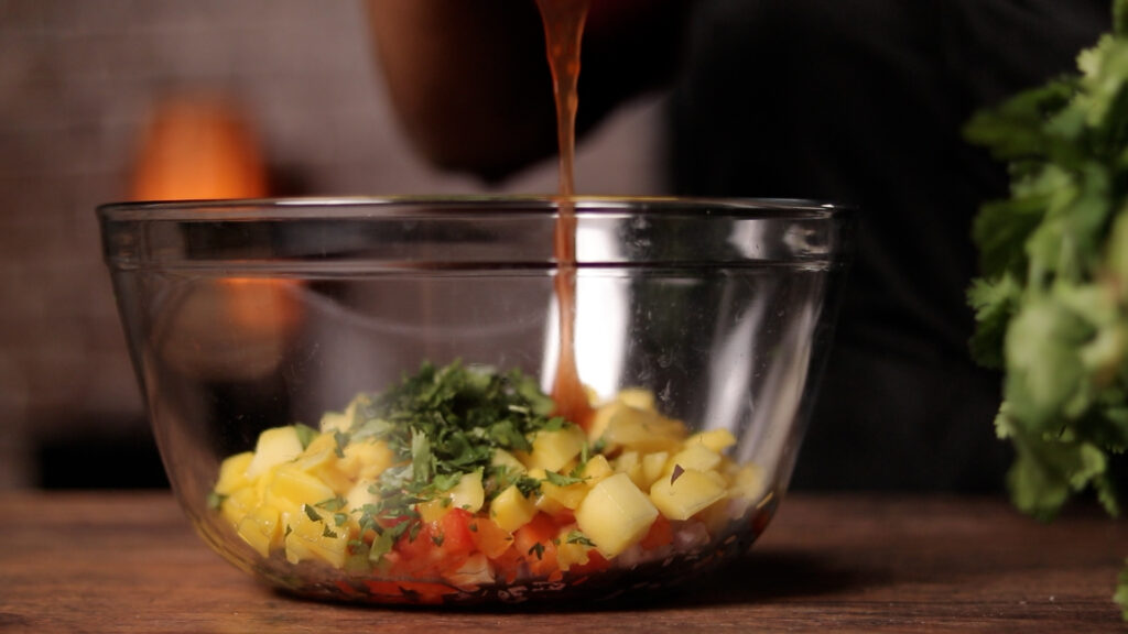 adding sweet chili sauce to mixing bowl