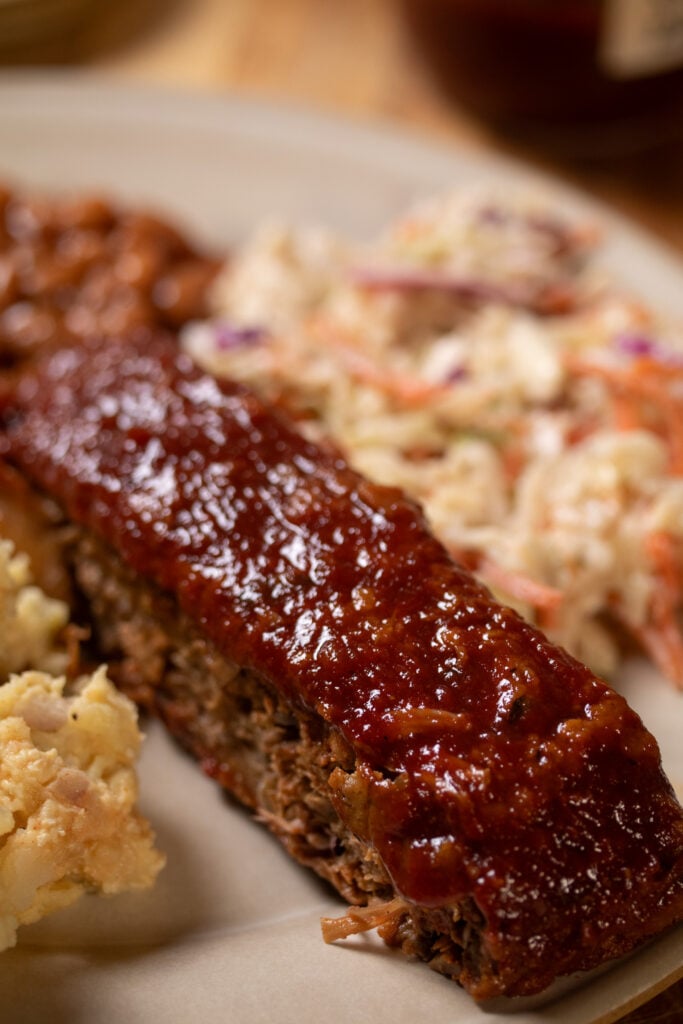vegan ribs on a plate with BBQ cookout sides