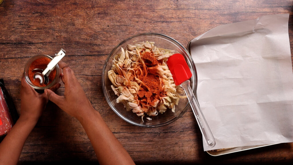adding BBQ Seasoning to a mixing bowl