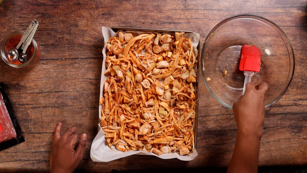 oyster mushrooms and jackfruit on a baking sheer