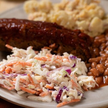 vegan coleslaw on a plate with BBQ recipes